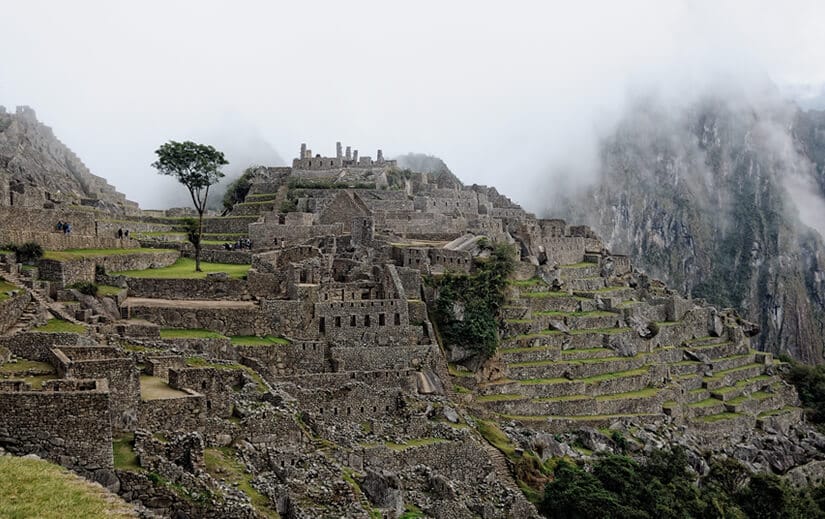 Machu Picchu The dawn mist lifts above the terraced structures