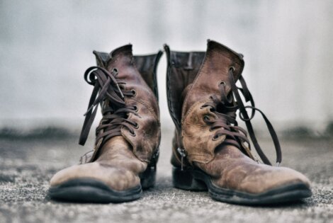 rugged boots on asphalt