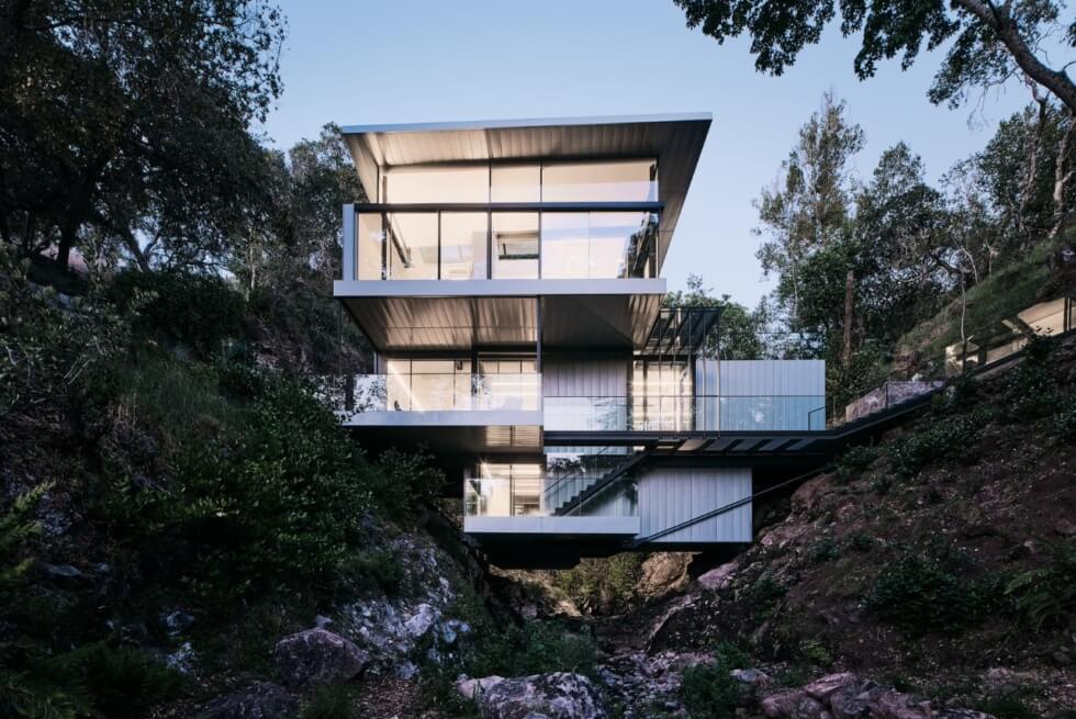 The Suspension House Hovers Over A Creek And Features Views Of A Waterfall
