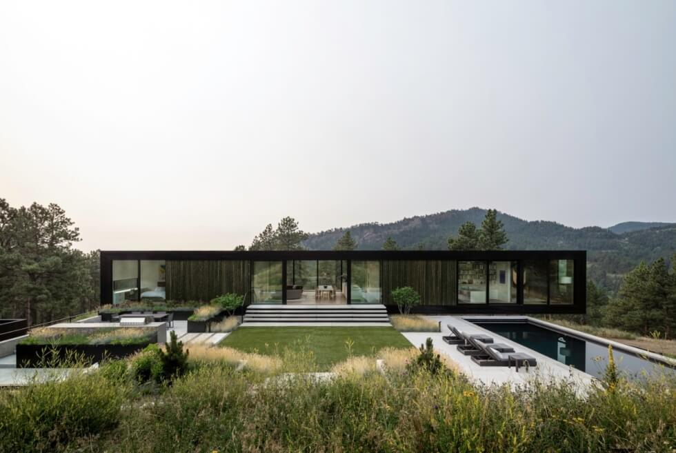 The Blur House Floats Like A Black Bar On Its Rugged Landscape